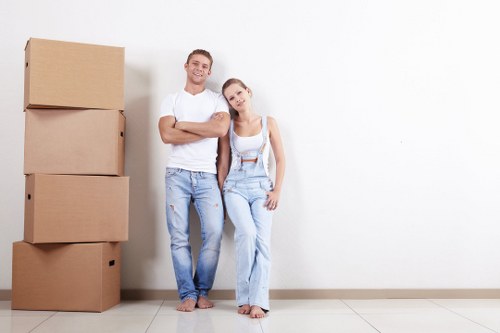 Professional office movers handling equipment in Roehampton