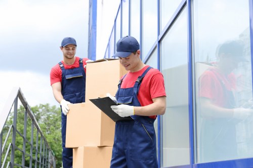 Professional team handling office equipment during a commercial move in Roehampton
