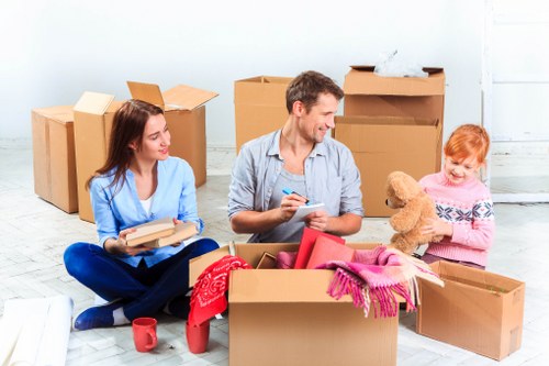 Expert packers carefully handling delicate items